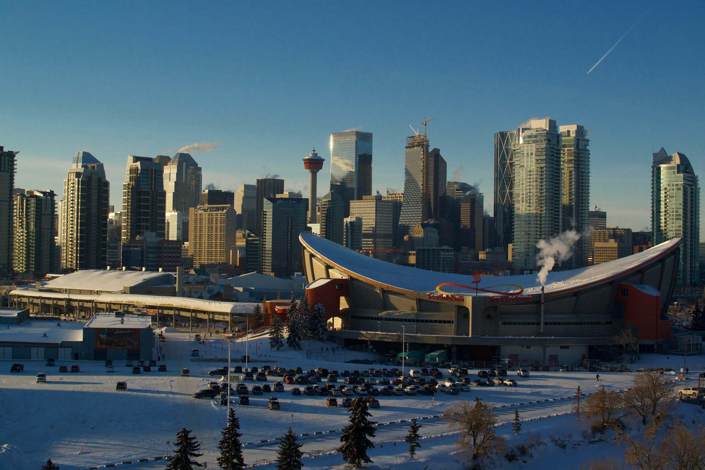 Downtown Calgary and the Saddledome on a clear winter afternoon, snow on the ground